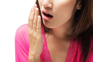 Young Woman Checking her Breath