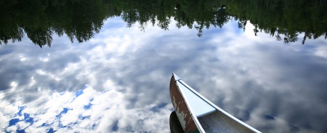 Canoe on perfectly calm lake